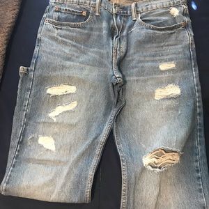 Levi’s 502 Light Wash Ripped Jeans